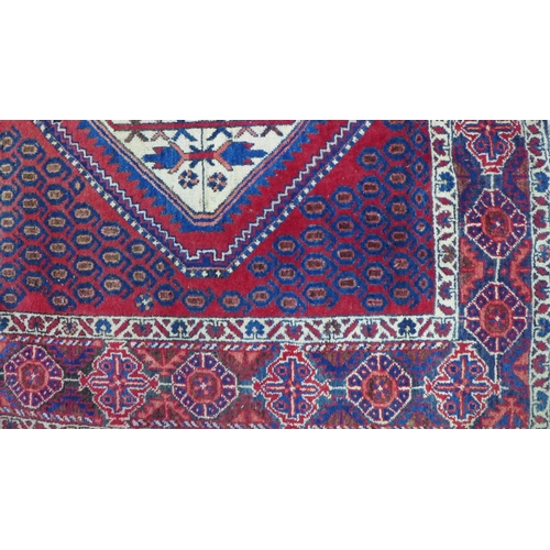 274 - Kazak rug,  red field. with two ivory lozenge and a flowerhead border  204 x 150cm. (a/f)