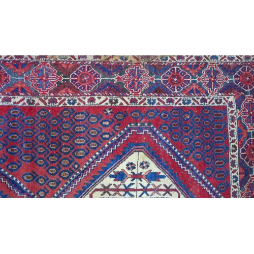 274 - Kazak rug,  red field. with two ivory lozenge and a flowerhead border  204 x 150cm. (a/f)