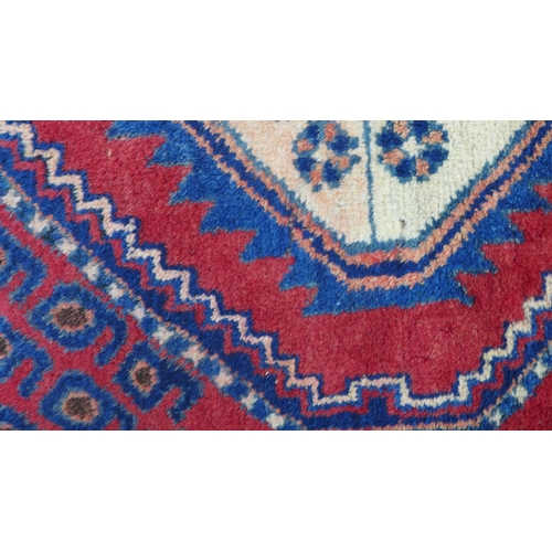 274 - Kazak rug,  red field. with two ivory lozenge and a flowerhead border  204 x 150cm. (a/f)