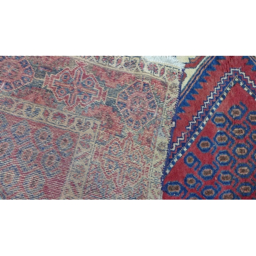 274 - Kazak rug,  red field. with two ivory lozenge and a flowerhead border  204 x 150cm. (a/f)