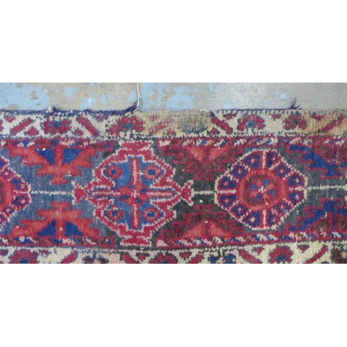 274 - Kazak rug,  red field. with two ivory lozenge and a flowerhead border  204 x 150cm. (a/f)