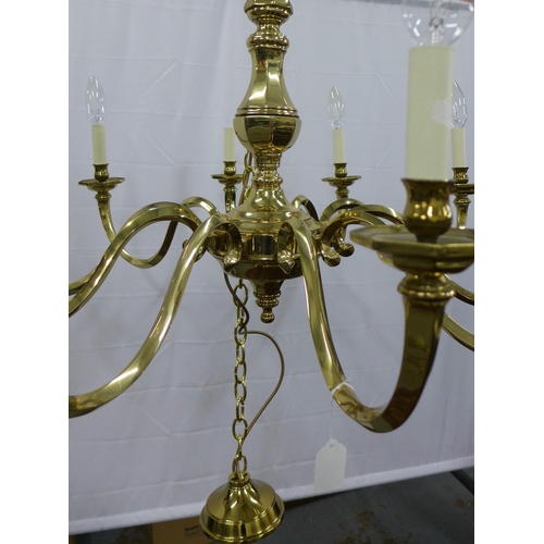 280 - Large & heavy Dutch style brass chandelier, ten scrolling arms with octagonal scones and candle styl... 