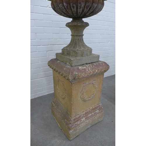 283 - Pair of large garden urns on stands. (one is A/F) 123 x 58cm. (2)