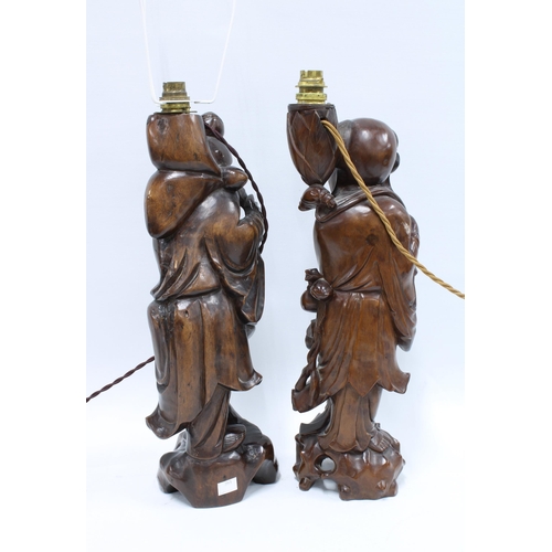 385 - Two chinoiserie figural rootwood table lamp bases, 43cm (2)