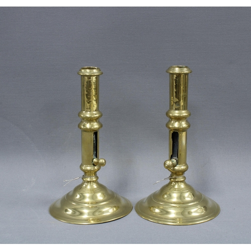 387 - Pair of brass candlesticks with pushers, wick scissors, silver plated hot milk pot and a glazed terr... 