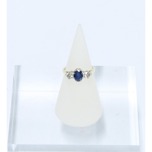 39 - Sapphire and diamond three stone ring, the central oval cut sapphire of approx. 0.75ct flanked by tw... 