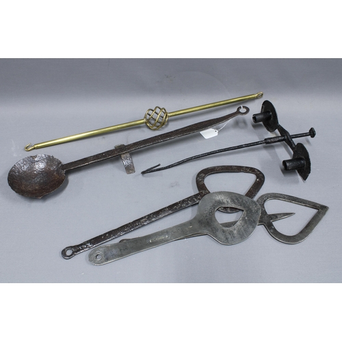 391 - Collection of hand forged items to include an iron ladle 62cm long, double candlestick, etc and a br... 