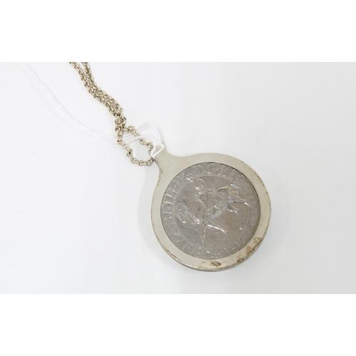 44 - QEII Silver Jubilee commemorative coin in a silver mount suspended on a silver chain