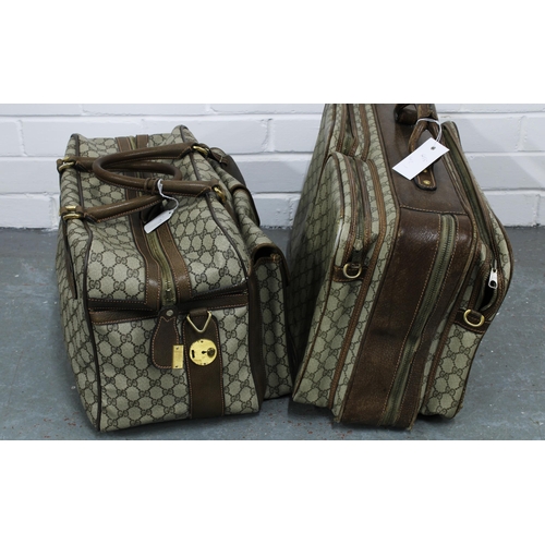 455 - Vintage Gucci leather and canvas luggage to include a medium soft body suitcase with two front pouch... 