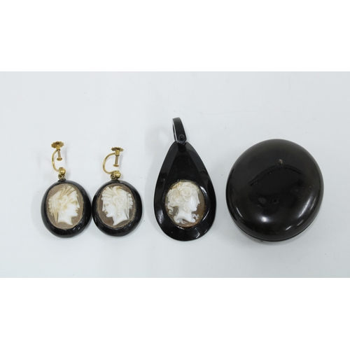 49 - Whitby Jet to include a locket, pendant and pair of drop earrings with cameo panels, (4)