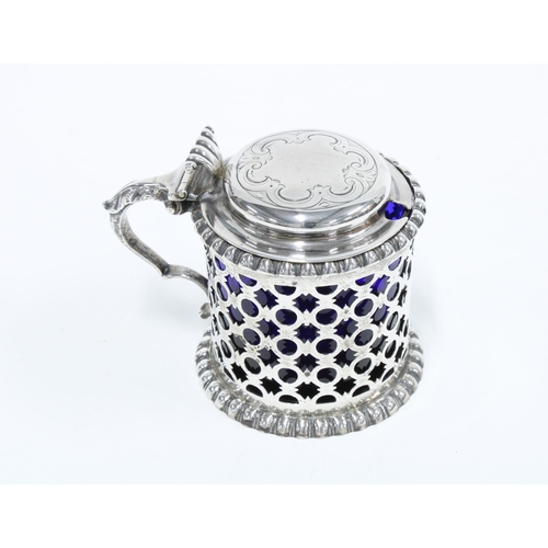 63 - Victorian silver drum mustard with pierced circular decoration, blue glass liner and shaped thumbpie... 