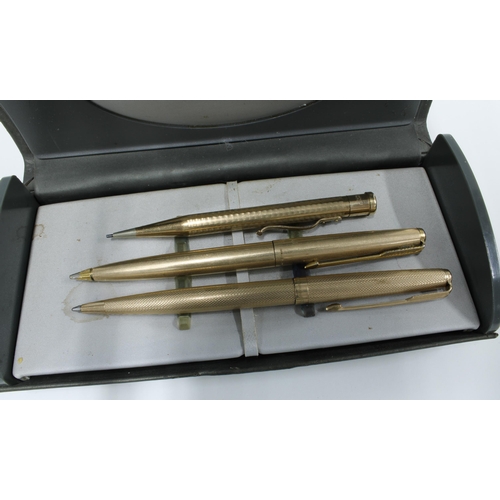 96 - 9ct gold Parker ballpoint pen, gold plated Parker 61 ballpoint pen and a rolled gold propelling penc... 