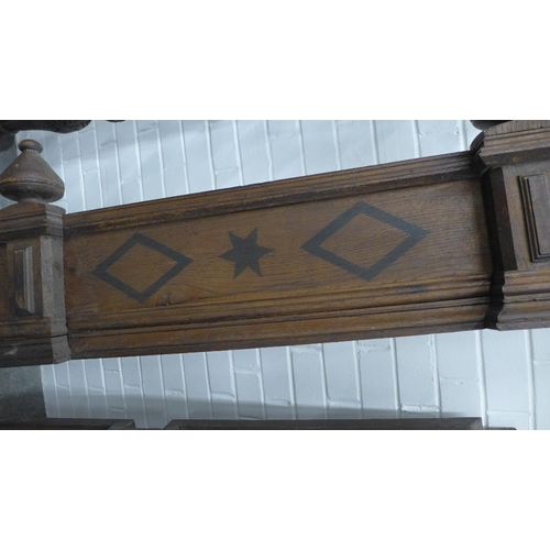 254 - Oak tester bed, triple inlaid panelled back and carved lozenge panelled canopy. 250 x 154 x 220cm. (... 