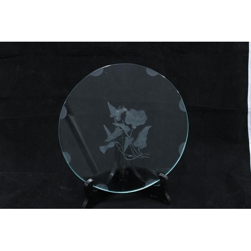 101 - Set of six early 20th century glass plates, each with an etched floral pattern (6)