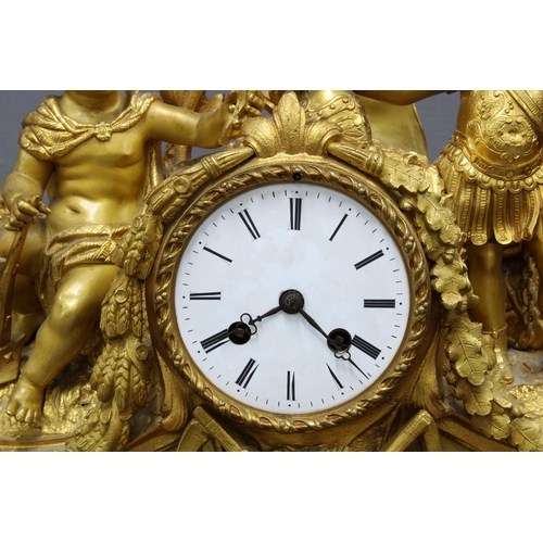 103 - French gilt metal figural mantle clock, with a circular dial with roman numerals within a classical ... 