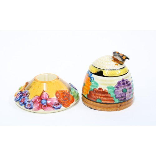 132 - Clarice Cliff My Garden candlestick 9cm, and a Clarice Cliff Gayday beehive honey pot and cover (cov... 