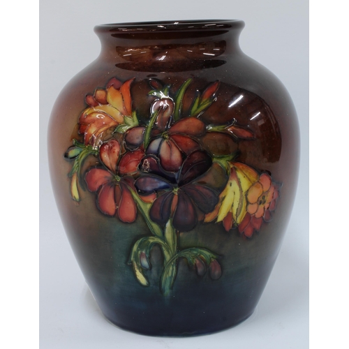 143 - Large Moorcroft Orchid and Spring flowers vase, flambe  ground, facsimile and impressed factory mark... 