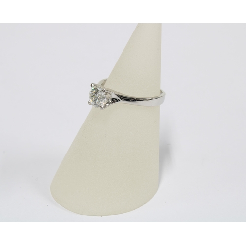 18 - Platinum diamond solitaire ring, the claw set round brilliant cut diamond is approx 0.70ct, stamped ... 