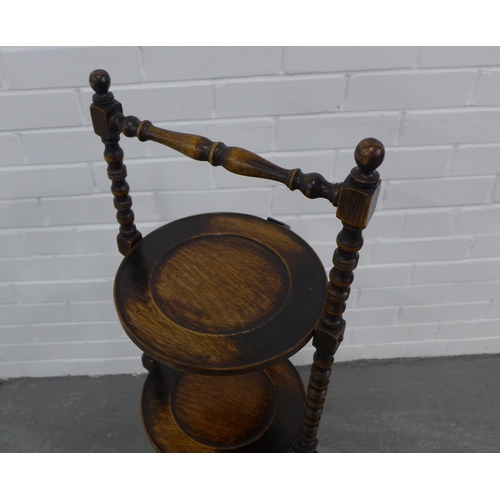 204 - An oak three tier cake stand. 99 x 31cm.