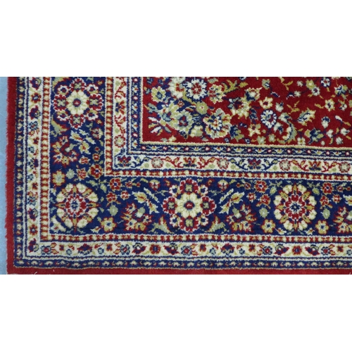 216 - Belgian wool rug, red foliate field. 232 x 172cm.