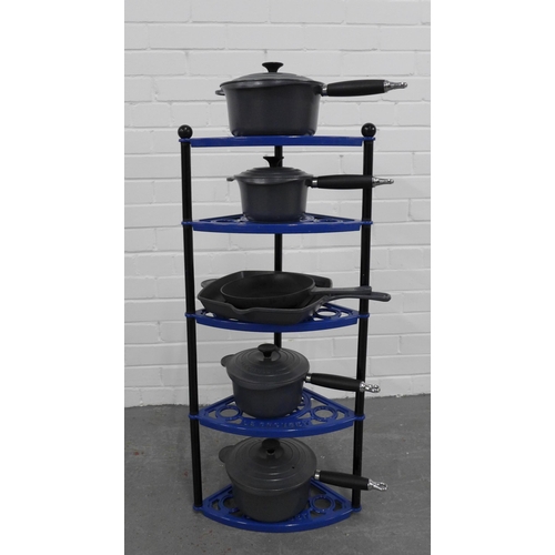 217 - A set of six  Le Creuset pots and pans, with a blue metal five tier Le Creuset stand