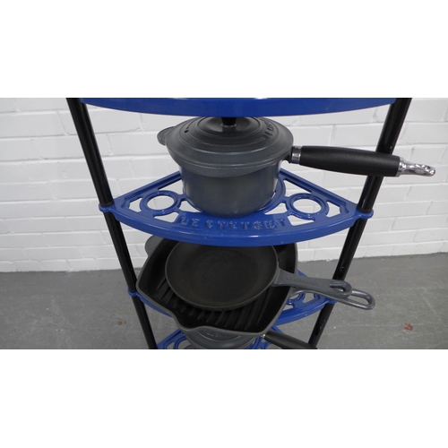 217 - A set of six  Le Creuset pots and pans, with a blue metal five tier Le Creuset stand