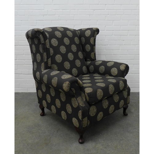 225 - Modern wing armchair with contemporary upholstery, on cabriole legs, 103 x 94 x 54cm