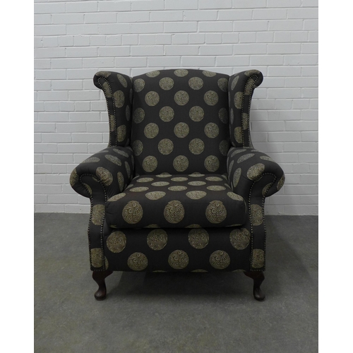 225 - Modern wing armchair with contemporary upholstery, on cabriole legs, 103 x 94 x 54cm