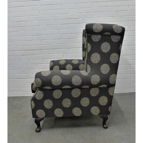 225 - Modern wing armchair with contemporary upholstery, on cabriole legs, 103 x 94 x 54cm