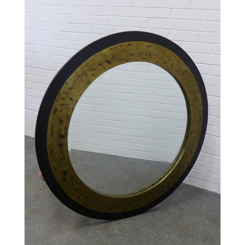 230 - Contemporary circular wall mirror with an ebonised and gilt frame, 109cm