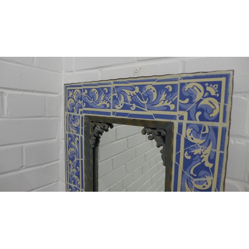 256 - Blue an white tiled wall mirror, 54 x 42cm