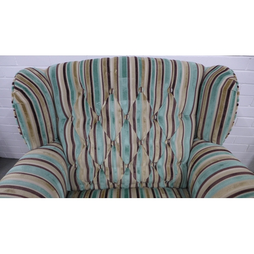 261 - Contemporary buttonback armchair with striped upholstery, on mahogany legs with brass caps and casto... 