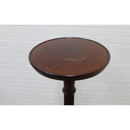 264 - Mahogany torchere, circular top on a fluted column 152 x 46cm