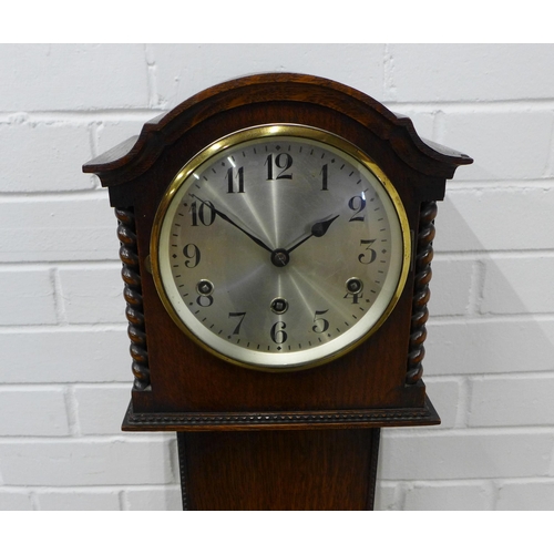 275 - Oak Grandmother clock, silvered dial with arabic numerals flanked by barley twist pilasters, 133 x 3... 