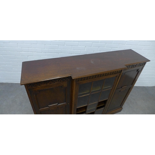 277 - Early 20th century dark oak breakfront cabinet 107 x 137 x 36cm (a/f)