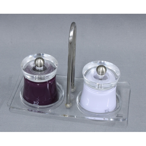 305 - Contemporary Peugeot salt and pepper grinders, in a clear plastic stand