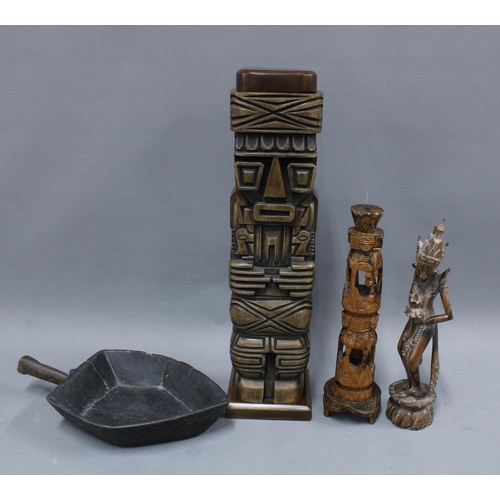 306 - Carved wooden totem style figure with detachable top, a wooden shovel and two Eastern carved wood fi... 