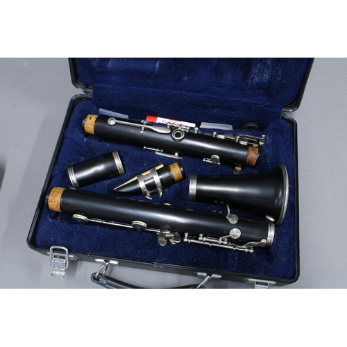 310 - Two cased instruments to include a flute and a clarinet (2)