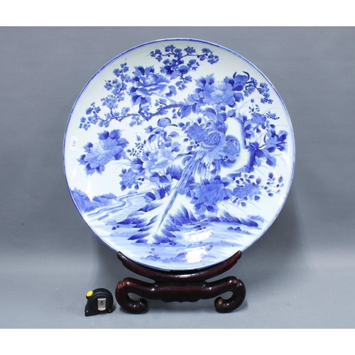 312 - Meiji Japanese blue and white charger, of large size, decorated with bird and foliage, four characte... 