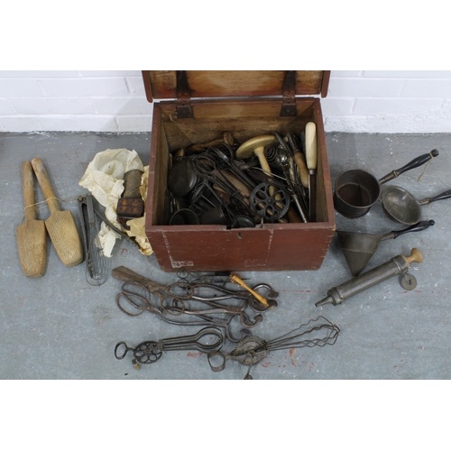 317 - A large collection of vintage kitchenalia to include whisks, butter pats, piping instruments, etc (a... 