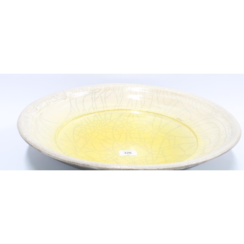 326 - John Dunn, a large studio pottery bowl with yellow and grey craquelure pattern, signed to base, 45cm