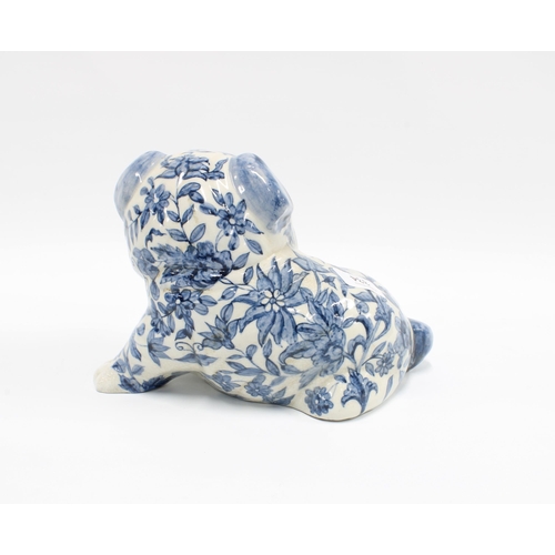 334 - Blue and white pottery pug dog, 24cm long