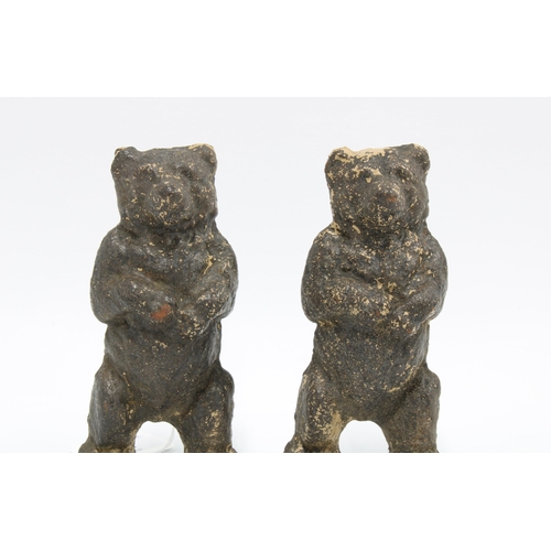 337 - A pair of late 19th / early 20th century cast iron bears, with remnants of paint, 15cm