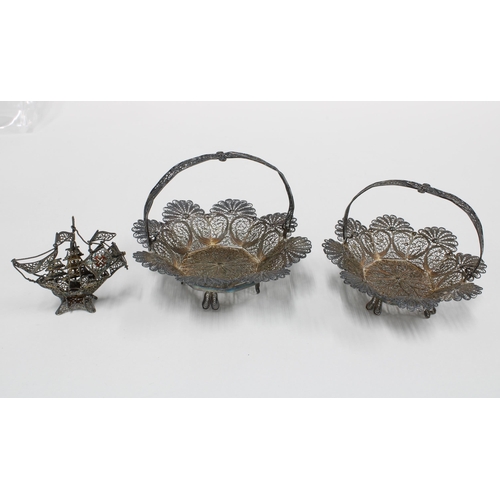 34 - A pair of white metal filigree baskets and a small filigree galleon, 5cm (3)