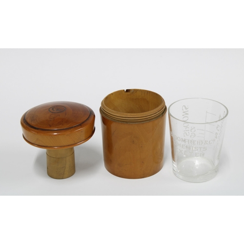 367 - Fruitwood medicine jar and cover containing a glass beaker with teaspoon and tablespoon markers 8cm