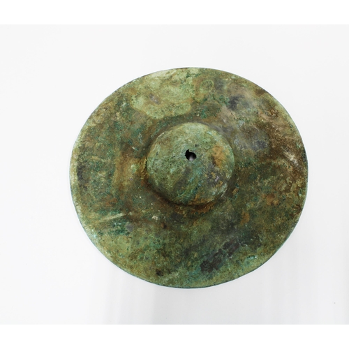 434 - Persian shield boss with fragments of fabric, 15cm diameter.
Provenance: Axel Guttmann collection