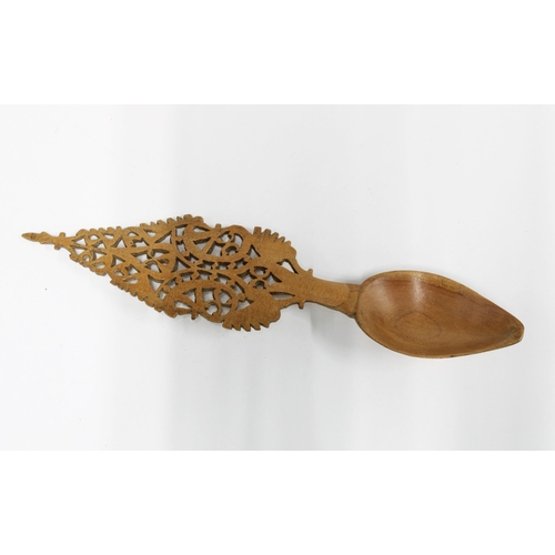 437 - Qajar sherbet spoon, carved fruitwood with a pierced handle, 19cm