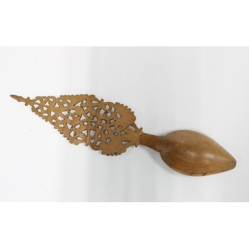 437 - Qajar sherbet spoon, carved fruitwood with a pierced handle, 19cm