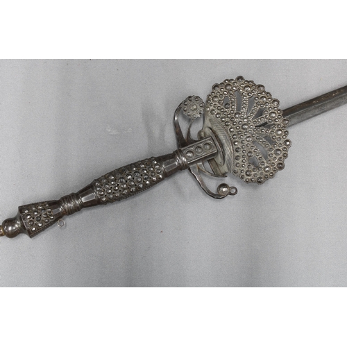 443 - Cut steel court sword, the grip and guard with raised cut diamond shaped facets, rapier blade, inscr... 