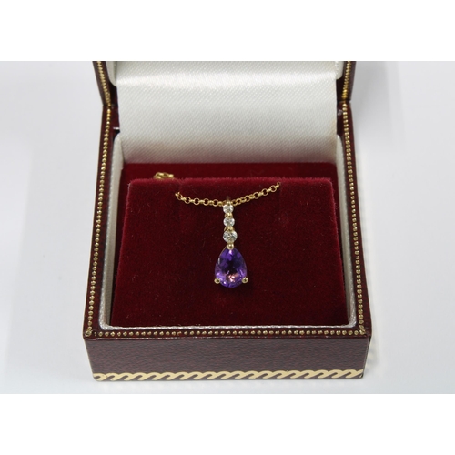 5 - 9ct gold amethyst and diamond pendant on a 9ct gold chain